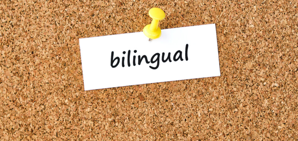 Bilingual.,word,written,on,a,piece,of,paper,or,note,
