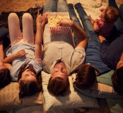 Overhead,view,of,family,enjoying,movie,night,at,home,together