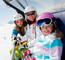 Skiing, ,happy,skiers,on,ski,lift